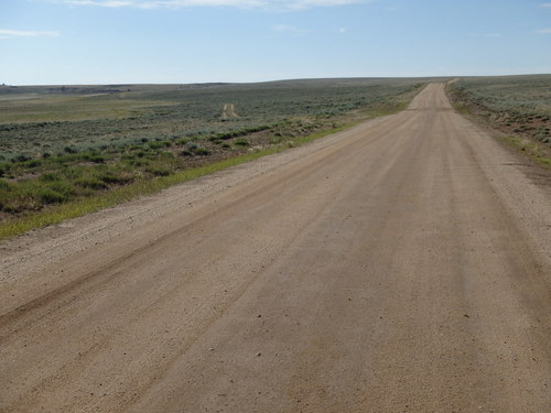 GDMBR: Pedaling eastward with a peek at what is probably old wagon ruts at the 11:30 position.